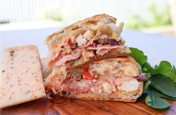 Muffaletta & TomaRashi Grilled Cheese on plate