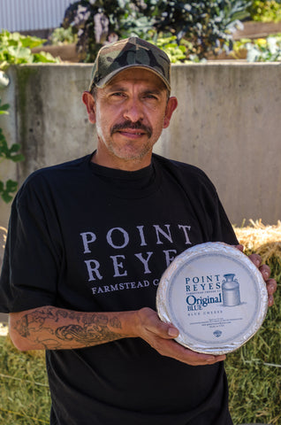 Employee holding cheese 2