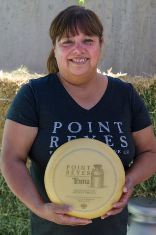 Employee holding cheese 2