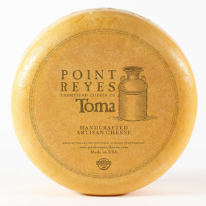 Toma cheese wheel