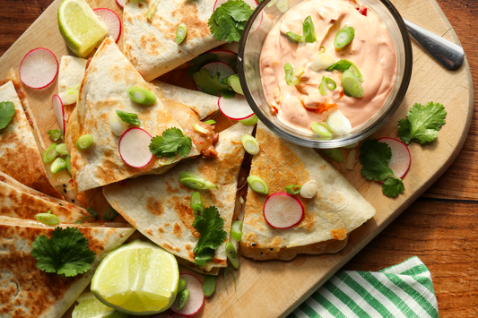 Bean and cheese quesadillas in triangles on boardd