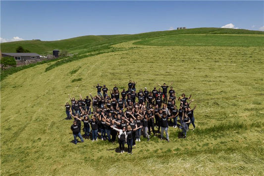 PRFC employees in field-drone shot