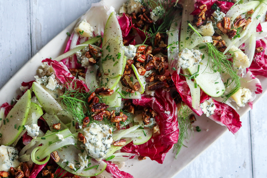 green salad with red cabbage, apples, blue cheese