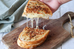 Grilled Cheese on a board with TomaProvence