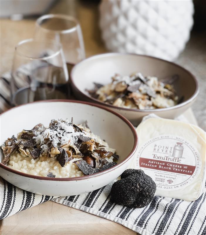 TomaTruffle Risotto in a bowl on a striped napkin