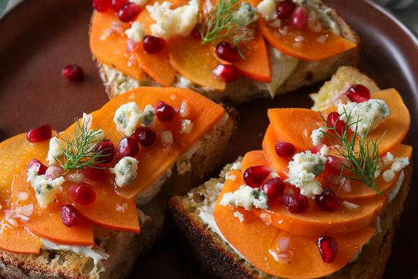persimmons, pomegranate seeds and Bay Blue on toast