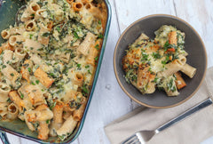 Spinach Artichoke Pasta with TomaTruffle and Gouda in a dish and on a plate