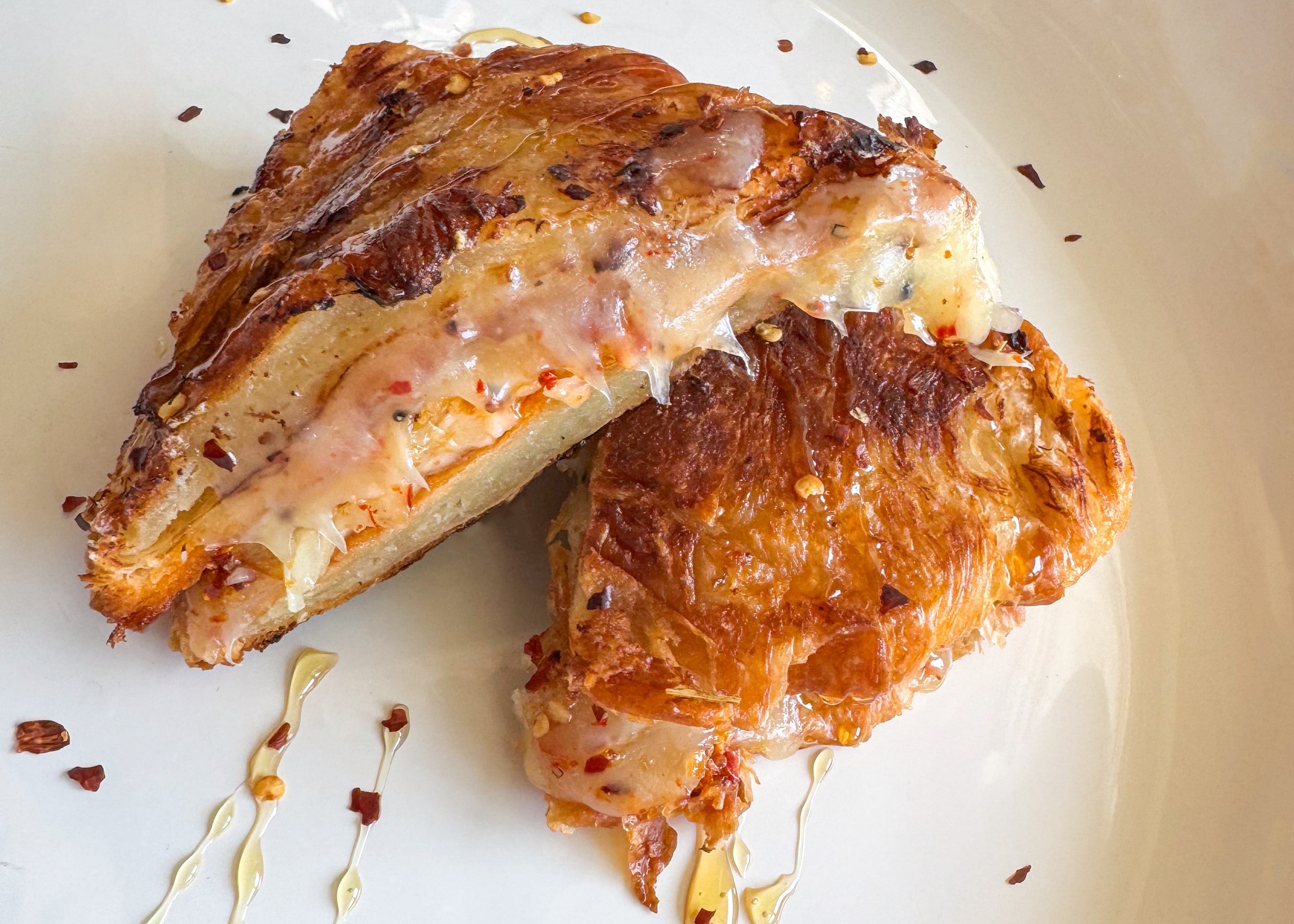 TomaRashi Chili Crunch Croissant Grilled Cheese