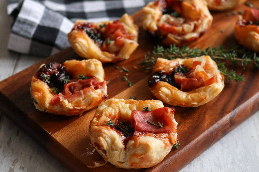 puff pastry bites on a wooden board