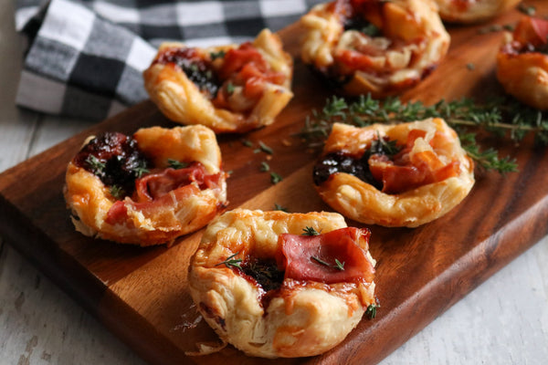puff pastry bites on a wooden board