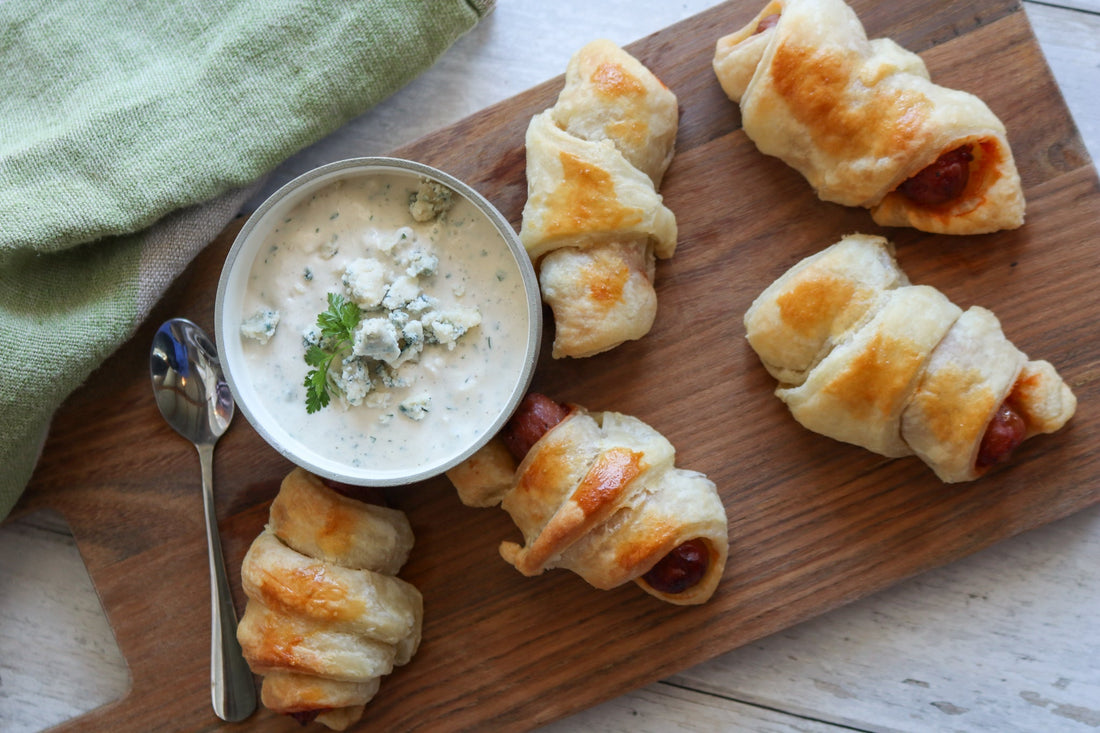 pigs in blankets with bay Blue dip on a board 