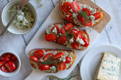 Toast with tomatoes and Fennel Blue on a plate