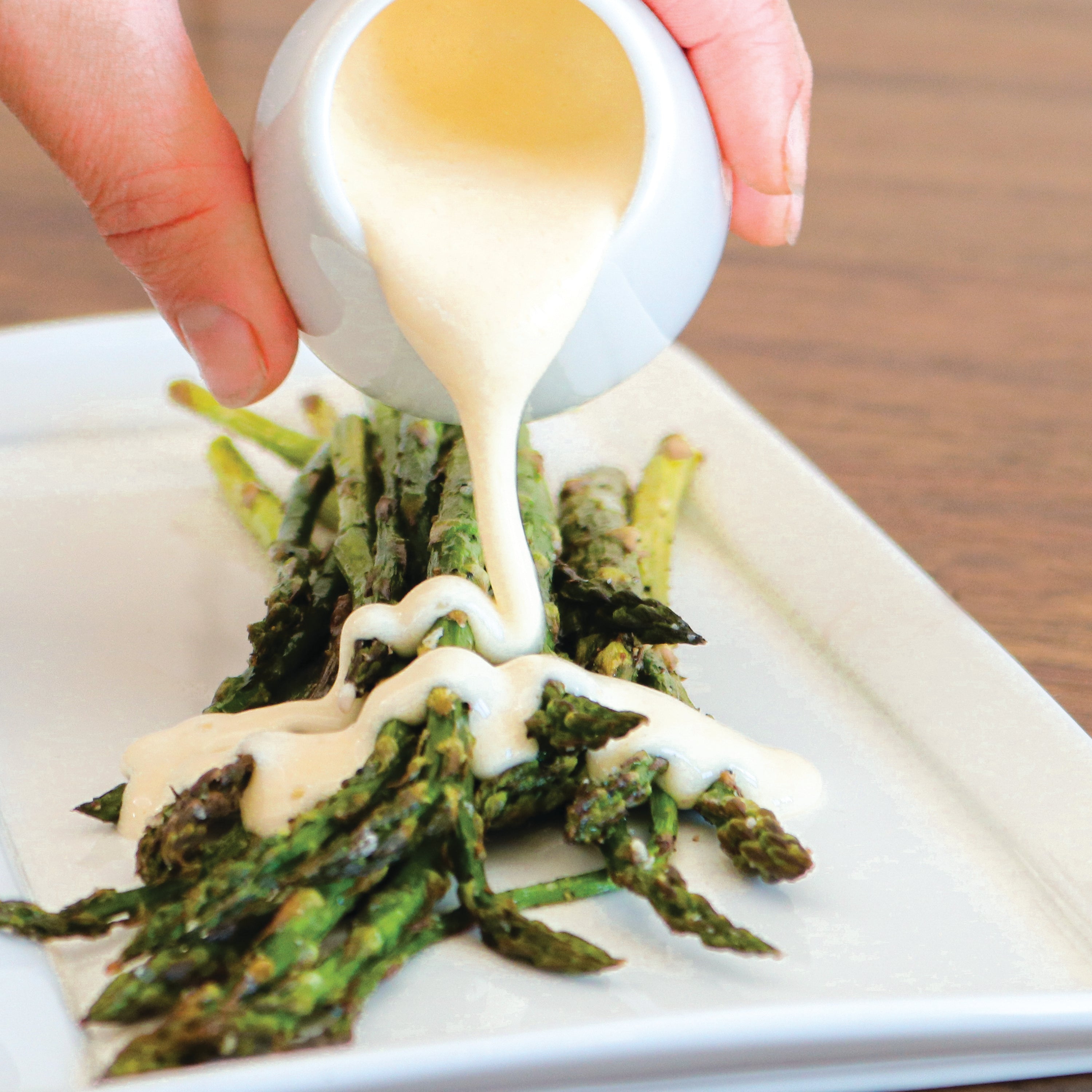 TomaTruffle Fonduta over asparagus 