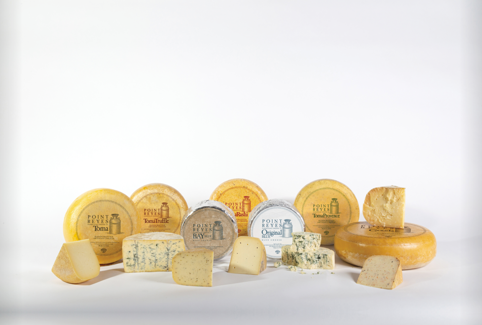 A grouping of cheese wheels