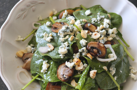 Spinach Salad with Warm Maple-Balsamic Dressing, Sautéed Mushrooms, Toasted Hazelnuts and Original Blue 