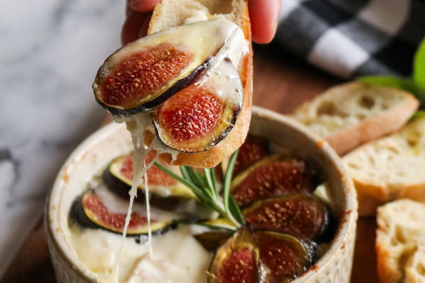 baked truffle brie with sliced fresh figs in dish
