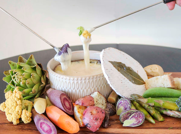 Quinta fondue surrounded by spring vegetables