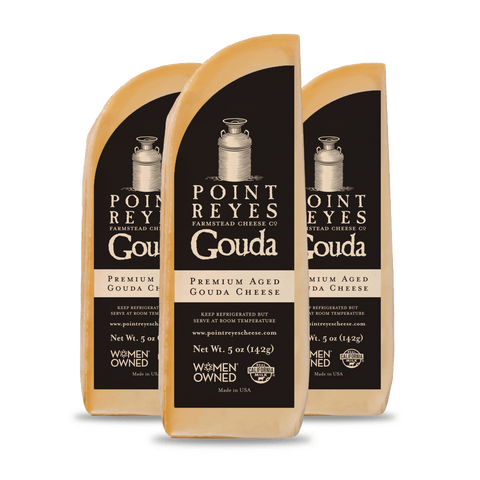 Product: Three packages of Point Reyes Gouda cheese on a white background