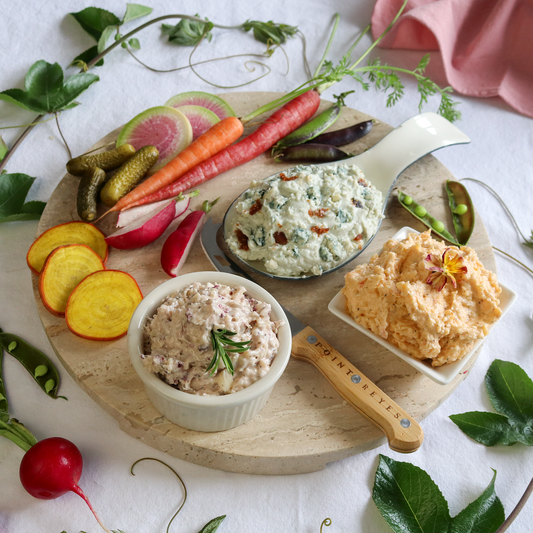 spread the love cheese gift pack prepared on a round board