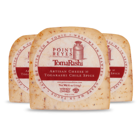 Product: Three blocks of Point Reyes Togarashi Artisan Cheese on a white background