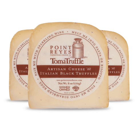 Product: Point Reyes Toma Truffle cheese with label on a white background