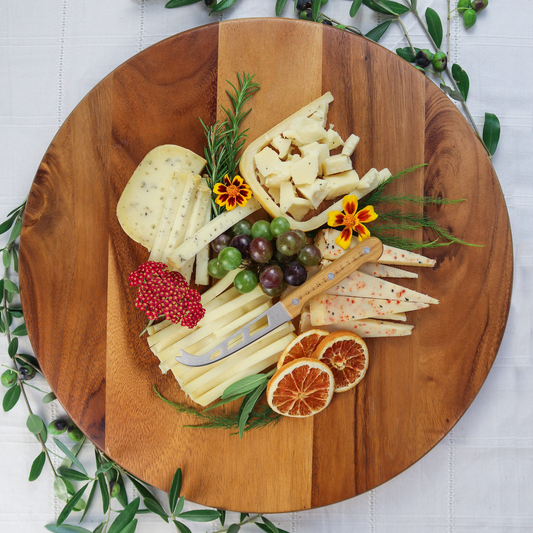 Toma with attitude cheese collection on wooden board