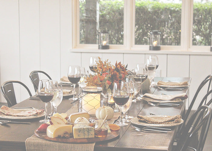 set dining table with wine and cheese