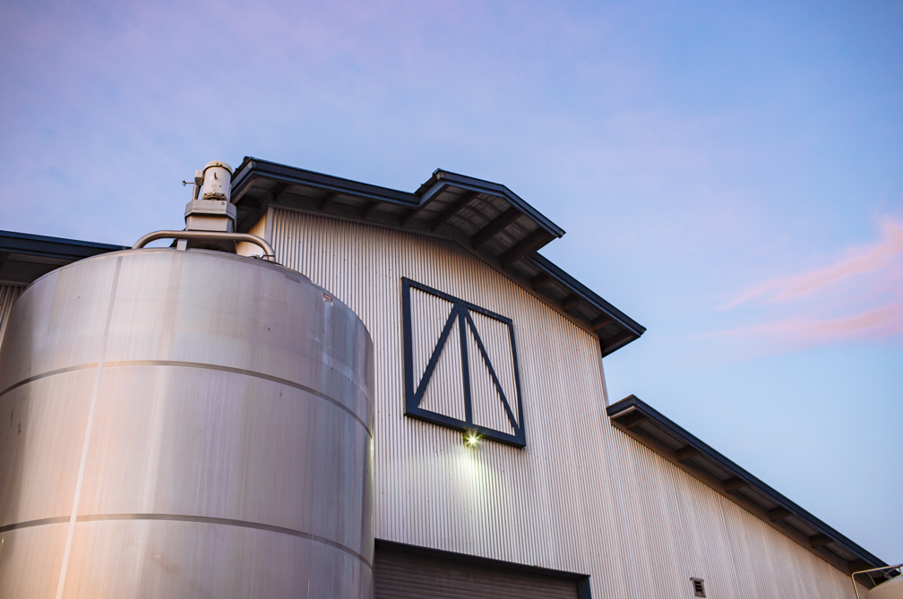 cheese production building at sunset