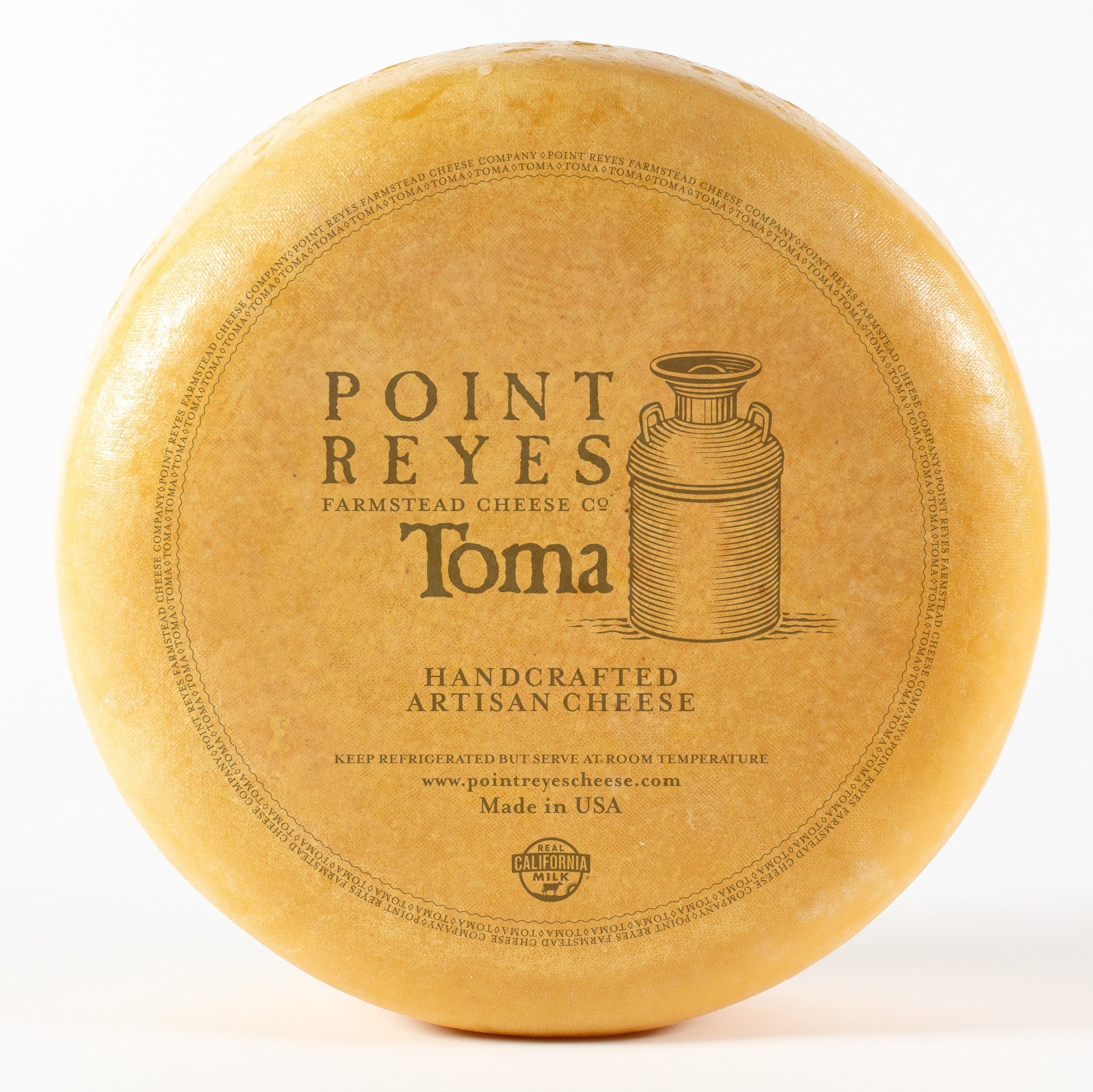 Toma cheese wheel